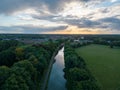 Summer dawn over foggy forest and river aerial drone view. Aerial panoramic landscape with sunset over the river and Royalty Free Stock Photo