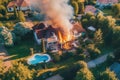 On a summer day, an aerial view captures the sight of a fire engulfing a modern villa. The flames dance and consume the