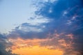 Summer day beautiful cloudy sunset backdrop, natural landscape photography with golden-blue colorful sky, sun rays from bottom Royalty Free Stock Photo