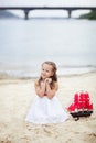 Summer day. Happy childhood carefree game on the open sand. The concept of rest. Girl on the sea with a ship. portrait of the girl Royalty Free Stock Photo