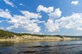 Summer day landscape with river, forest and cloudy sky Royalty Free Stock Photo