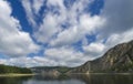 Summer day landscape with river, forest and cloudy sky Royalty Free Stock Photo