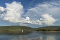 Summer day landscape with river, forest and cloudy sky and tanker Royalty Free Stock Photo