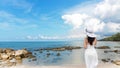 Summer Day. Lifestyle woman wearing white dress fashion summer beach on the sandy ocean beach.