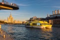 Summer day in Moscow - the Poryachiy bridge over Moskva river at Zaryadye Park in Moscow, the boat on the river. Royalty Free Stock Photo