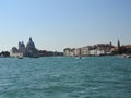 Summer day view from the water to the Venetian lagoon with the Basilica of Santa Maria della Salute in Venice, Italy