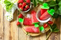 Summer dessert. Homemade strawberry frozen fruit juice, Strawberry Ice cream or strawberry popsicles on a rustic table. Copy space Royalty Free Stock Photo