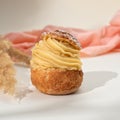 Summer desserts. Shu cake choux. Cake profiteroles with whipped cream. Royalty Free Stock Photo