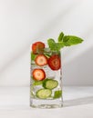 Summer detox drink. Strawberry, mint and cucumber refreshing water.Infused detox water with berry, vegetable and herb. Ice cold Royalty Free Stock Photo