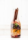 Summer detox and refreshing drink lemonade with fresh fruits, berries and herbs in glass bottle