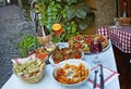 Unidentified people eating traditional italian food in outdoor restaurant in Trastevere district