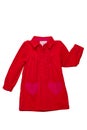 Summer dress isolated. A beautiful red girl`s dress with attached heart shaped pockets and long sleeves isolated on white. Royalty Free Stock Photo