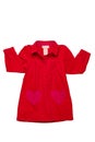 Summer dress isolated. A beautiful red girl\'s dress with attached heart shaped pockets and long sleeves isolated on white. Royalty Free Stock Photo