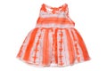 Summer dress isolated. Closeup of a beautiful orange white sleeveless baby girl dress isolated on a white background. Children Royalty Free Stock Photo