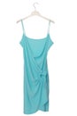 Summer turquoise dress is on white clothes-hanger