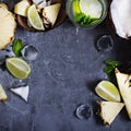 Summer drink, cocktail, tea, tropical fruits, pineapple, coconut, lime, summer background.