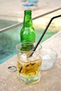 Summer drink in a glass near the swimming-pool Royalty Free Stock Photo