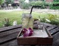 Summer drink lemongrass water and syrup outdoors in sunny day. Royalty Free Stock Photo