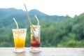 Summer drink on the table with mountains landscape background Royalty Free Stock Photo
