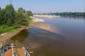 Summer drought on the river and low water on the banks Royalty Free Stock Photo