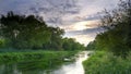 Summer evening golden light on the River Itchen - full of Water Crowfoot (Ranunculus aquatilis) and a well known chalk stream fly