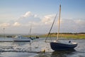 Summer evening landscape of leisure boats in harbor at low tide Royalty Free Stock Photo