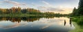 Summer evening landscape on Ural lake with pine trees on the shore, Russia Royalty Free Stock Photo