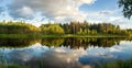 Summer evening landscape on Ural lake with pine trees on the shore, Russia Royalty Free Stock Photo