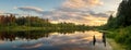 Summer evening landscape on Ural lake with pine trees on the shore, Russia Royalty Free Stock Photo