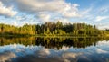 Summer evening landscape on Ural lake with pine trees on the shore, Russia Royalty Free Stock Photo