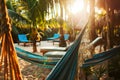Summer evening tropical beach scene with hammocks and lounge chairs