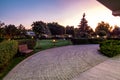 Summer evening view of landscaped garden of luxurious country estate Royalty Free Stock Photo