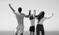 Summer family. Back view of happy young family walking on beach. Child with parents holding hands. Full length poeple. Royalty Free Stock Photo