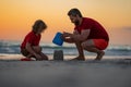 Summer family. Kid and father building sandcastle. Father and son playing on summer beach. Father and child son playing Royalty Free Stock Photo