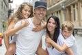 Summer family portrait of parents and kids outside