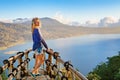 Young woman looking at amazing tropical lake in mountains Royalty Free Stock Photo