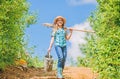 Summer farming. farmer little girl. garden, shovel and watering can. kid worker sunny outdoor. family bonding. spring