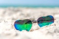 Summer Fashion heat shape sunglasses on sea beach under clear blue sky. Summer holiday relax Royalty Free Stock Photo