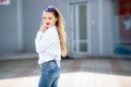 Summer, fashion and people concept - bright stylish portrait pretty woman in sunglasses against colorful wall in the Royalty Free Stock Photo