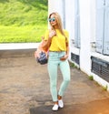 Summer, fashion and people concept - stylish pretty hipster woman in sunglasses outdoors in city