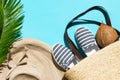 Summer fashion tropical concept. Women`s female beachwear straw hat wicker bag canvas striped shoes coconut green palm leaf Royalty Free Stock Photo