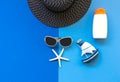 Summer Fashion woman big hat and accessories in the beach. Tropical sea.Unusual top view, colorfull background. Royalty Free Stock Photo