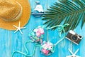 Summer Fashion woman big hat and accessories, vintage camera go to travel in the beach. Tropical sea.Unusual top view, blue backgr Royalty Free Stock Photo