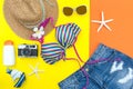 Summer Fashion woman swimsuit Bikini, camera, fish star, sunblock, sun glasses, hat. Royalty Free Stock Photo