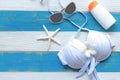 Summer Fashion woman swimsuit Bikini, starfish and spa flower. Travel and vacations in the holiday, wood white and blue background