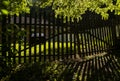 Summer. Fence. Old. Antique. Sunset. Shadow. Light shadow. Yard. Ukraine Royalty Free Stock Photo