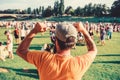 Summer fest. Man bearded hipster in front of crowd. Open air concert. Book ticket now. Early bird sale. Music festival Royalty Free Stock Photo