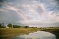 Summer field landscape after rain with rainbow. Eastern Europe, Ukraine Royalty Free Stock Photo