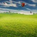 Summer field with lot of air balloons over horizon