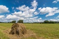 Summer field with mowed grass and haystack, Royalty Free Stock Photo